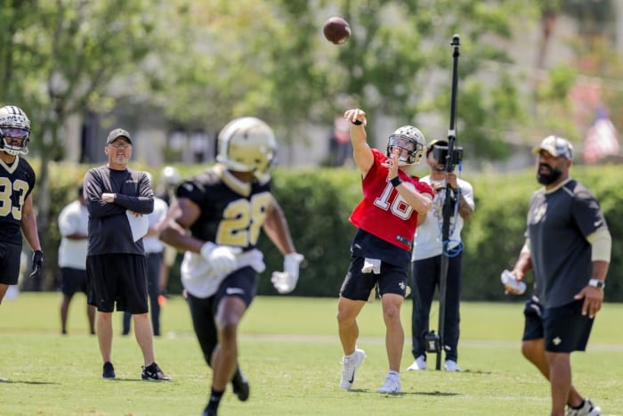 New Orleans Saints Ian Book (16) works on passing drills with Devine Ozigbo (28) during organized team activities at the Saints Training Facility. Mandatory Credit: Stephen Lew-USA TODAY Sports